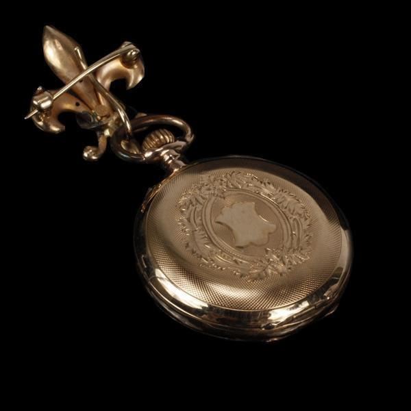 Yellow 14k gold lapel/ pendant watch with pearl on fleur de lis fob