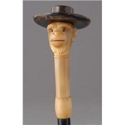 MONKEY CANE tortiseshell with an ebonised shaft, 