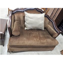 PLUSH UPHOLSTERED LOVE SEAT WITH CARVED BACK AND TACK ACCENTS