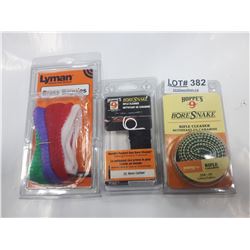 LOT OF TWO BORESNAKE RIFLE CLEANERS AND ONE PACKAGE LYMAN BRASS BAGGIES