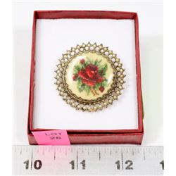 ESTATE BROOCH OF A NEEDLEPOINT ROSE