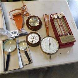 BAROMETERS THERMOMETERS AND MAGNIFYING GLASSES