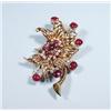 Image 1 : An 18 kt. gold, ruby and diamond retro brooch. In