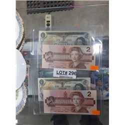PAIR OF CAD $2 , $1. 1986