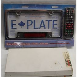 SCROLLING LICENCE PLATE FRAME AND OIL PAN HEATER