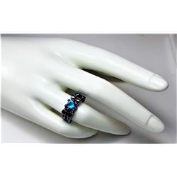 7)  AQUA MARINE ZIRCON RING SET IN BLACK