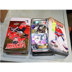 2 TINS OF ASSORTED HOCKEY CARDS.