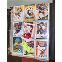 BINDER OF ASSORTED HOCKEY CARDS.
