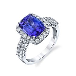 BARANOF JEWELERS Natural Tanzanite and Diamond Ring set in 14k White Gold.
