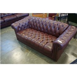 BURGUNDY LEATHER LOVESEAT BUTTON BACK AND BRASS STUDS