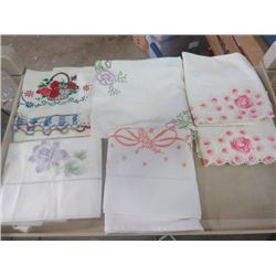 LOT OF HAND EMBROIDERED PILLOW CASES AND AN EMBROIDERED TABLE RUNNER