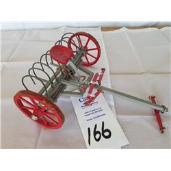 Hand carved wood dump rake