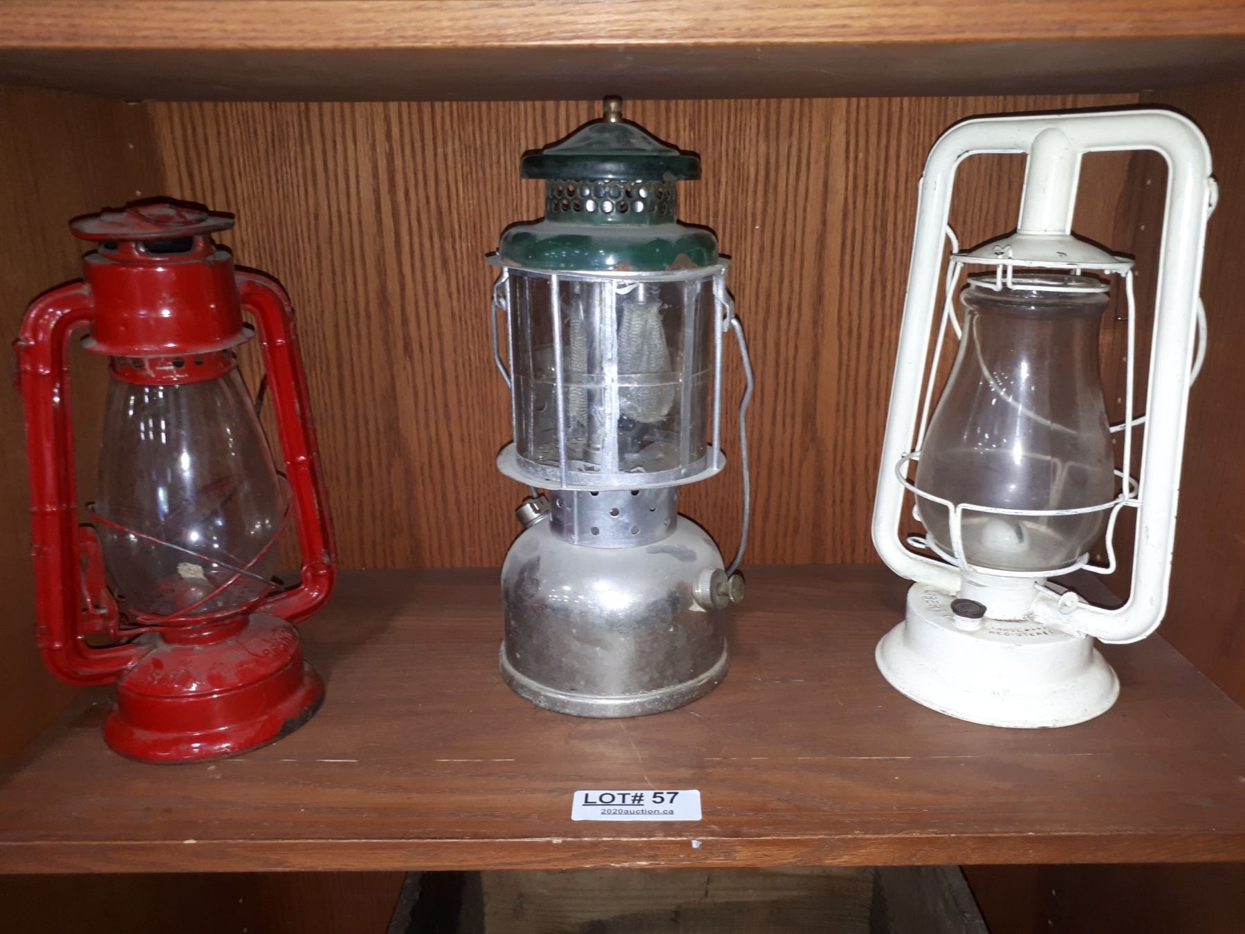 THREE CLEAR GLASS OIL LANTERNS