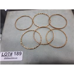 SIX GOLD TONE BANGLES