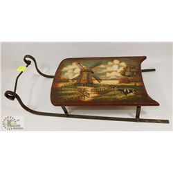 DECORATIVE SLEIGH WITH LIGHTHOUSE PAINTED ON IT