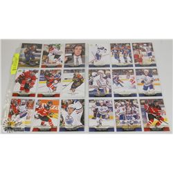 2 SHEETS WITH 18 DIFFERENT CONNOR MCDAVID CARDS.