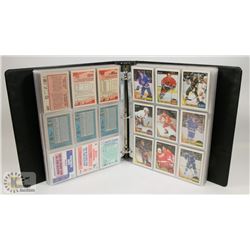 BINDER OF VINTAGE HOCKEY CARDS.