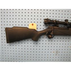 g082... Mossberg 300 Win Mag bolt action with scope