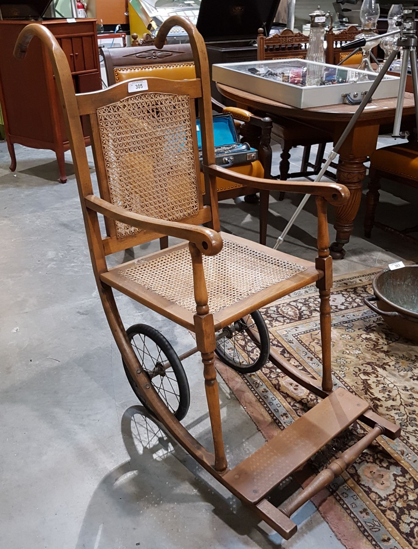 ANTIQUE CANE BACK WHEEL CHAIR