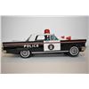 Image 2 : Japanese made pressed tin battery operated police car with shooting driver, in excellent all origina