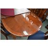 Image 2 : Quality solid cherry dining table with two large insert leaves and full sized protector/silencer pad