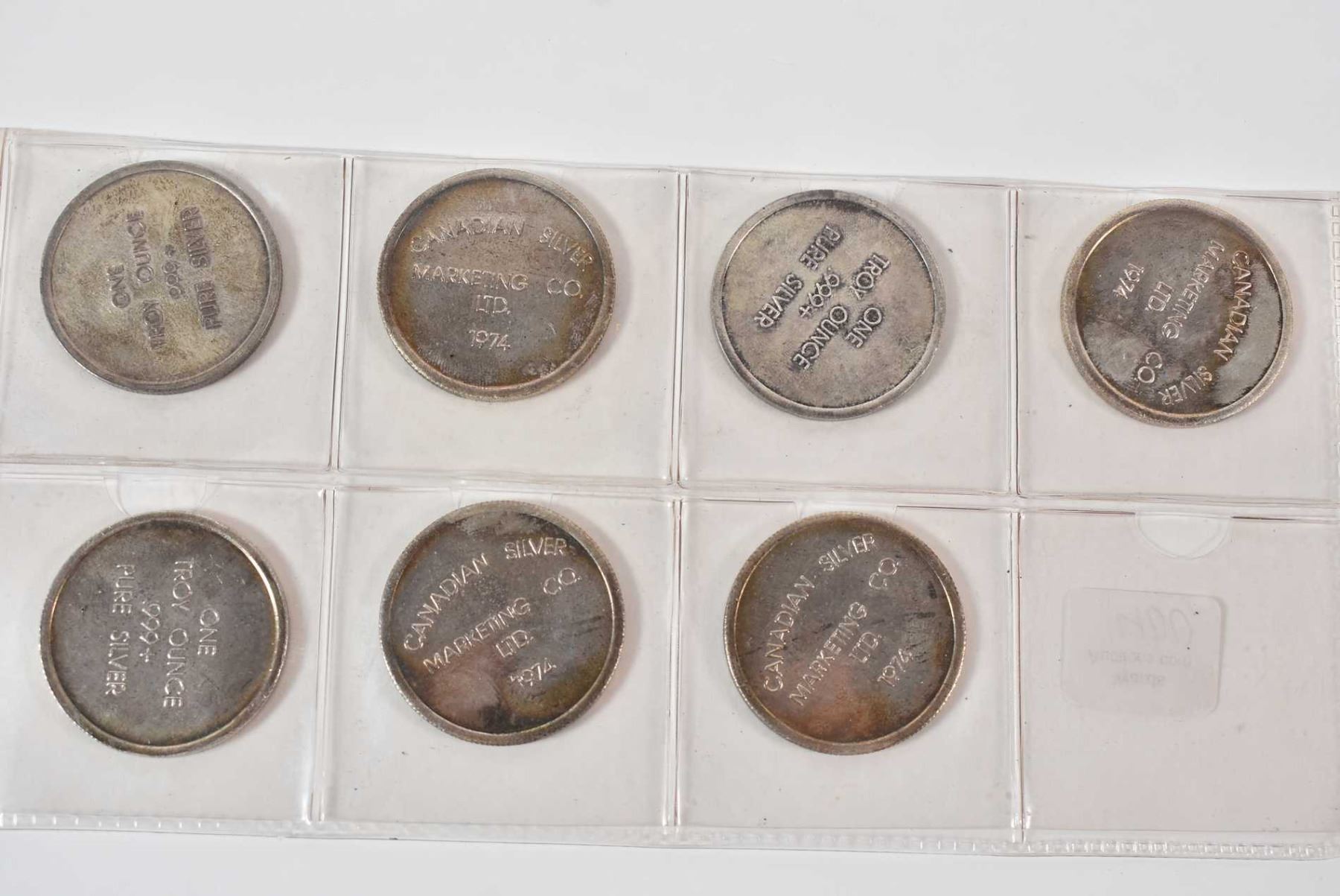 Set of seven one troy ounce .999 + pure silver round tokens marked ...