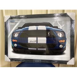 LIMITED EDITION, BEAUTIFULLY FRAMED POSTER OF THE MUSTANG SIGNED BY CARROLL SHELBY. COMES WITH COA. 