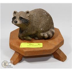 CEMENT RACCOON ORNAMENT ON A STAND