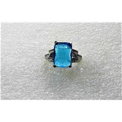 9)  LAB CREATED EMERALD CUT AQUAMARINE