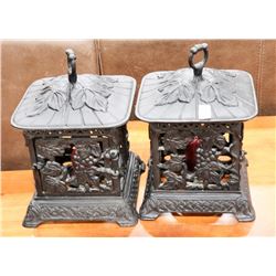 PAIR OF CAST IRON CANDLE HOLDERS