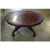 Image 1 : OVAL GLASS TOP CARVED COFFEE TABLE