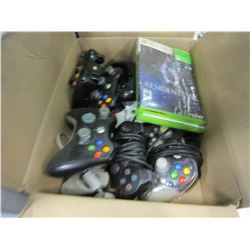 BOX OF VIDEOGAME CONTROLLERS AND VIDEOGAMES