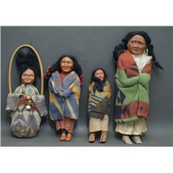 COLLECTION OF FOUR SKOOKUM DOLLS