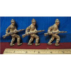 Collection of three stealthy Grey Iron toy soldie