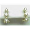 Image 1 : 14kt yellow gold three stone diamond earrings .75