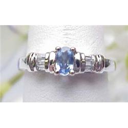 Ladys ring with 5x4mm oval sapphire and baguette 