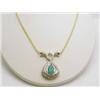 Image 1 : 14kt yellow gold necklace with pear shape emerald