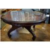 Image 2 : OVAL GLASS TOP CARVED COFFEE TABLE
