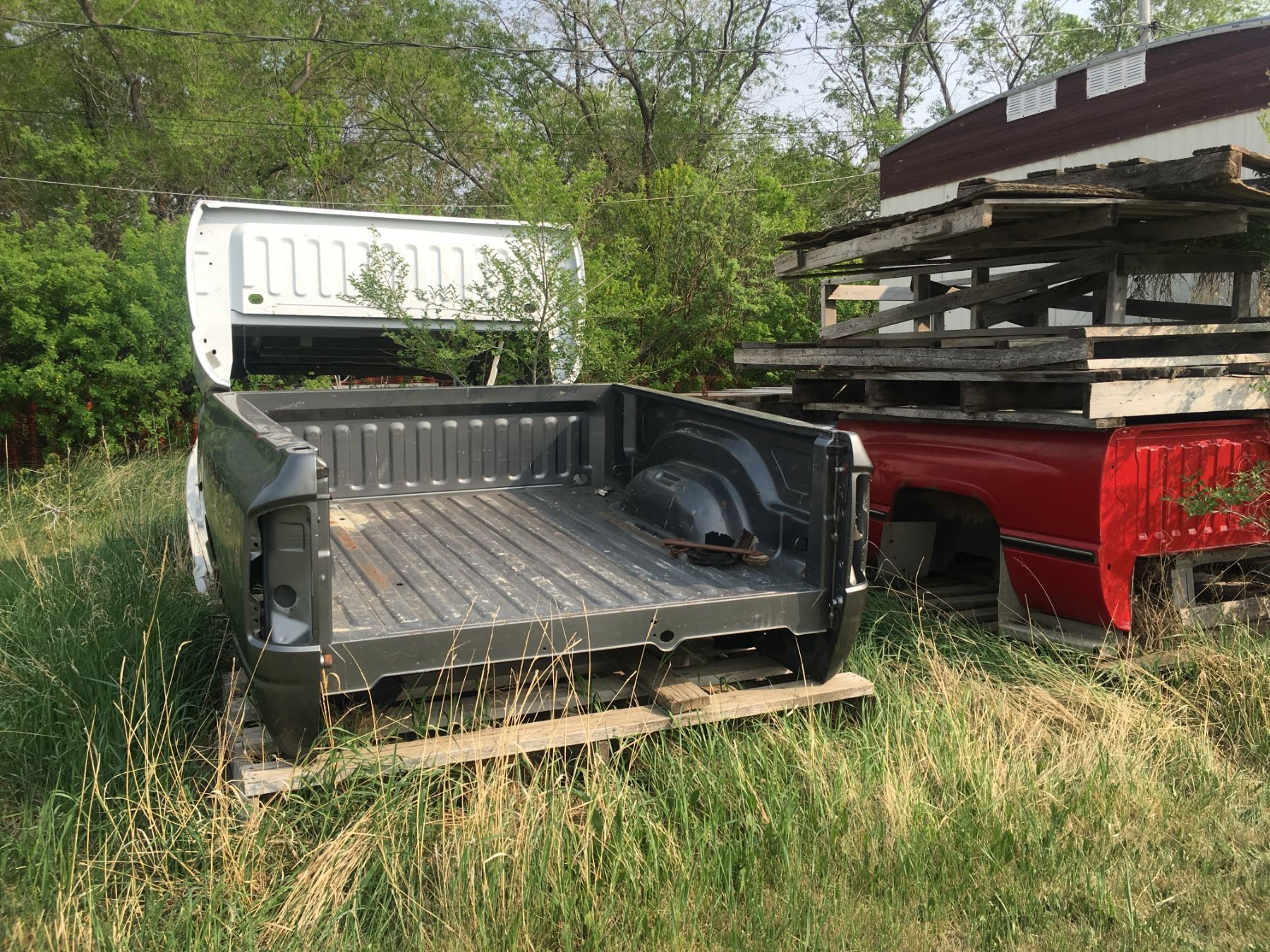5 truck boxes 2 white, 1 silver, 1 red, 1 black