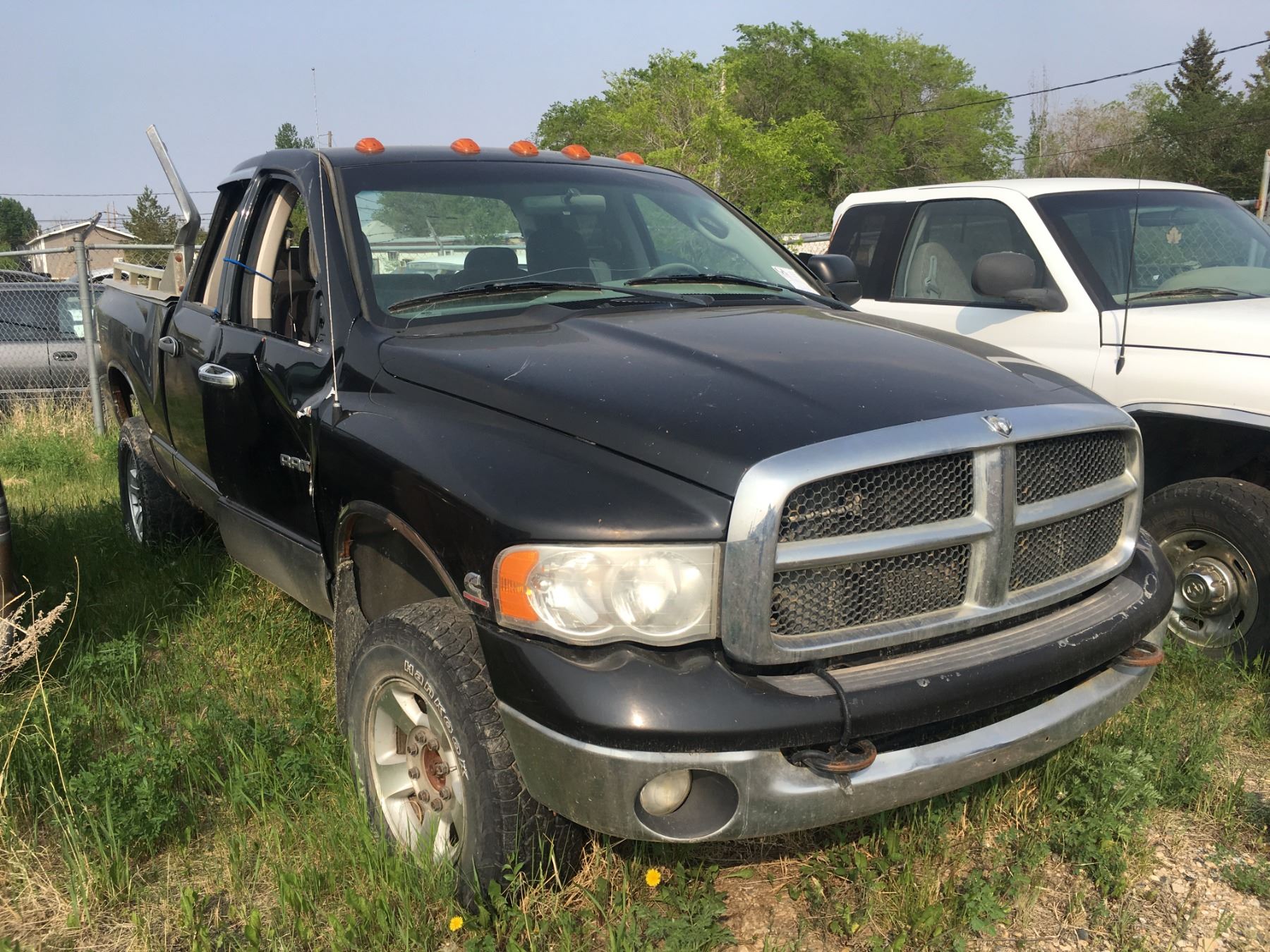 1 Ram 2500 Cummins diesel salvage truck plus 1 Dodge Laramie salvage