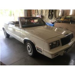1982 Chrysler Lebaron 2 dr convertible, white, 4 cyl. auto. appro. 85,000 klms, runs and drives well