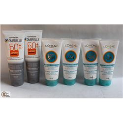 BAG W/ 2 BOTTLES OF SUNSCREEN AND 4 BOTTLES OF