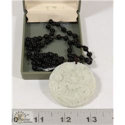 CARVED JADE PENDANT.