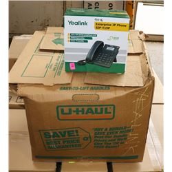 BOX OF YEALINK IP PHONES.