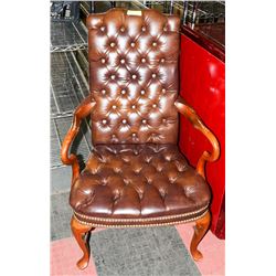 LEATHER AND WOOD ARMCHAIR. FURNITURE