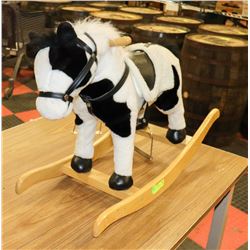 KIDS ROCKING HORSE WITH SOUND.