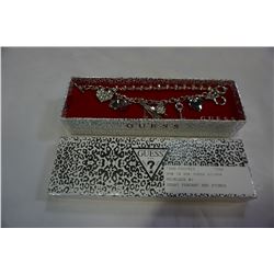 NEW IN BOX GUESS SILVER BRACELET W/ 8 CHARMS