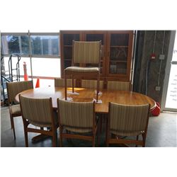 VINTAGE ROUND TEAK DINING TABLE, WITH 2 - 20 INCH EXTENSIONS, AND 8 VINTAGE UPHOLSTERED TEAK DINING 