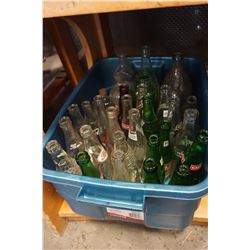 TOTE OF VINTAGE GLASS BOTTLES AND POP BOTTLES