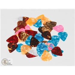NEW 25 PIECE SET OF THIN TUNER GUITAR PICKS.